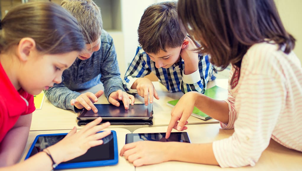 Elementary-students-having-fun-playing-online-games-on-tablets-Feature-Image