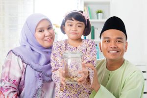 malay-family-saving-money-southeast-asian-home-muslim-father-mother-daughter-living-lifestyle-islamic-banking-concept-31735429